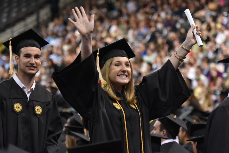May 2, 2015 Atlanta - Georgia Tech graduate Cambre Nicole Kelly, Biomedical Engineering major, celebrates after she received her degree during the Bachelor's morning ceremony of Spring 2015 Commencement at the McCamish Pavilion on Saturday, May 2, 2015. HYOSUB SHIN / HSHIN@AJC.COM