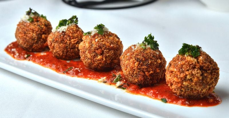 For a flavorful appetizer, you can go with the arancini (aka risotto balls) at Osteria di Mare. CHRIS HUNT / SPECIAL