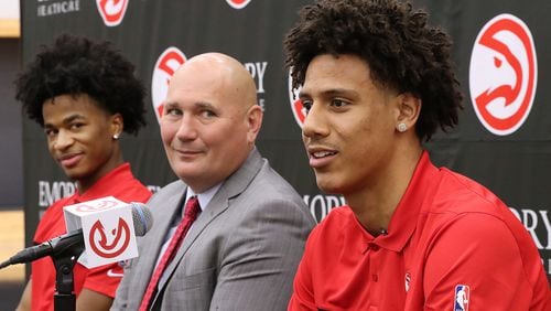 Atlanta Hawks President of Basketball Operations and General Manager Travis Schlenk (center) introduces Jalen Johnson (right, 20th overall pick) and Sharife Cooper (left, 48th overall pick) on Friday, July 30, 2021, in Atlanta.  Curtis Compton / Curtis.Compton@ajc.com