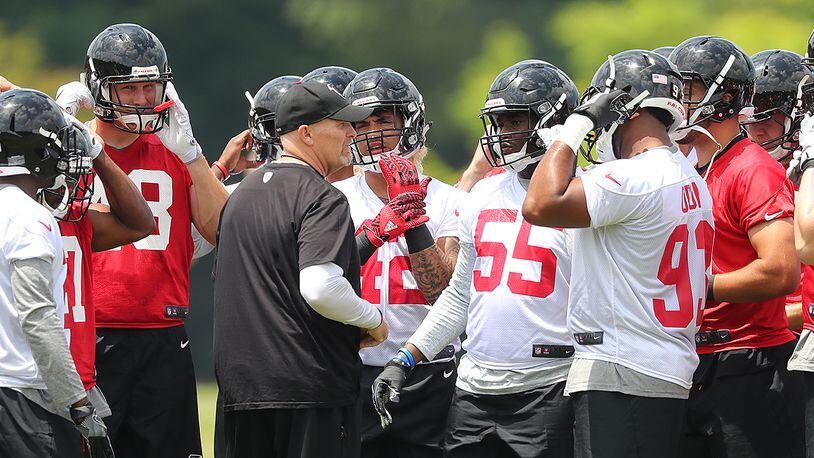 Falcons head coach Dan Quinn and his fresh crop of rookies take the field for rookie mini-camp on Friday, May 12, 2017, in Flowery Branch.