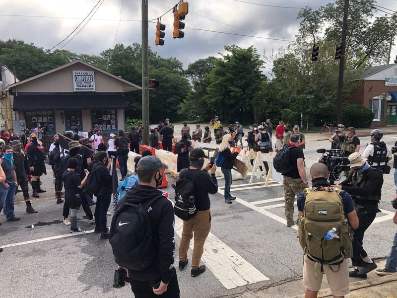 Saturday, Aug. 15., 2020, Stone Mountain -- Armed white supremacist militia members confronted leftist counter-protesters in downtown Stone Mountain.