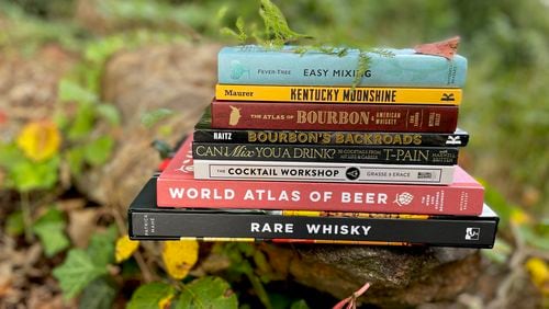 The season's crop of fall drink books includes hefty reference books, satirical recipe manuals and deep dives on specific categories such as Japanese drinking, moonshine and rare whisky. (Angela Hansberger for The Atlanta Journal-Constitution)