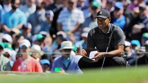 Tiger Woods lines up his attempt for a birdie on the seventh green, which his missed, during the first round of the Masters at Augusta National Golf Club on Thursday, April 5, 2018, in Augusta. Curtis Compton/ccompton@ajc.com