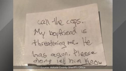A note given to staff at an animal hospital by a woman being held captive by her boyfriend, deputies said. (Photo: Volusia County Sheriff's Office)