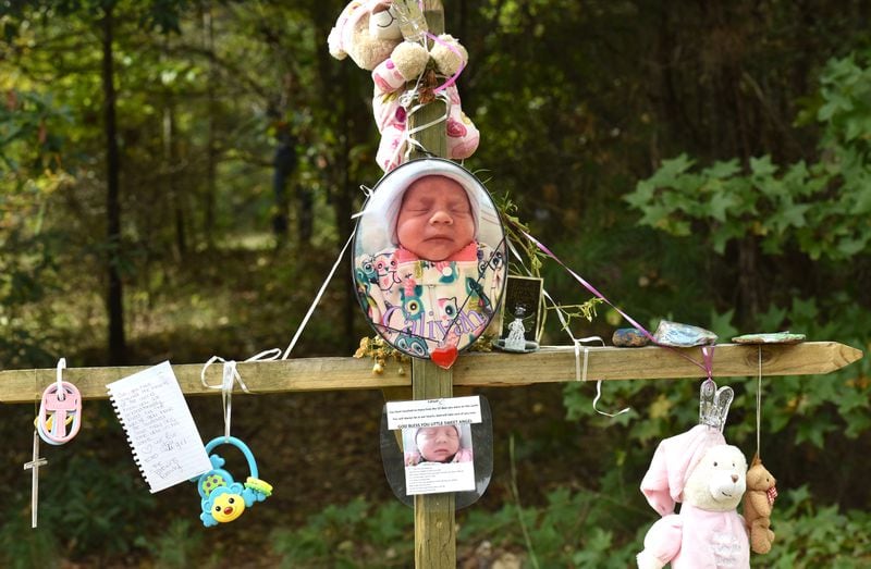 October 13, 2017 Covington - A memorial of flowers and letters is near the area where the newborn's body was found in Covington on Friday, October 13, 2017. Christopher McNabb is accused of killing his 15-day-old newborn inside the home by striking her in the head, according to investigators. Then, he allegedly wrapped her in a blanket and T-shirt, put her in a bag and attempted to hide her under debris, arrest warrants said. McNabb was charged with her death just days after pleading for the baby's return. HYOSUB SHIN / HSHIN@AJC.COM