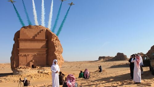 Saudi visitors watch an aerial flying display over Mada'in Saleh, a UNESCO World Heritage Site, in Mada'in Saleh, Saudi Arabia, onan. 31, 2017. Bloomberg photo by Vivian Nereim.