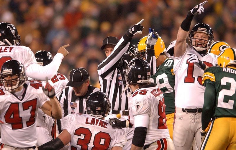 Falcons punter Chris Mohr and the referee signal the ball is the Falcons' as the Packers fumble a kickoff return setting up the Falcons' third touchdown in the first half. (Curtis Compton / AJC)