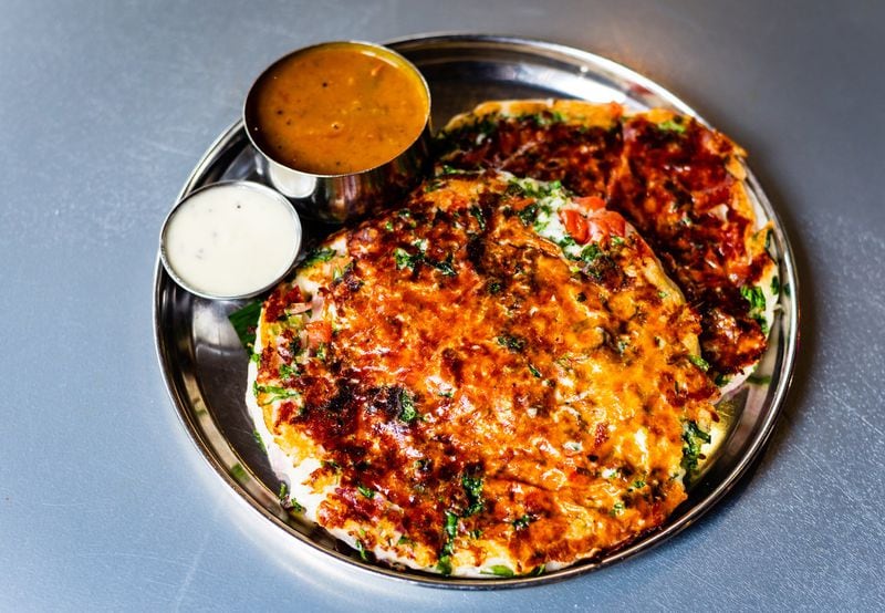 Chai Pani’s tomato and cheese uttapam combines pizzalike flavors with a hearty, complex pancake. CONTRIBUTED BY HENRI HOLLIS