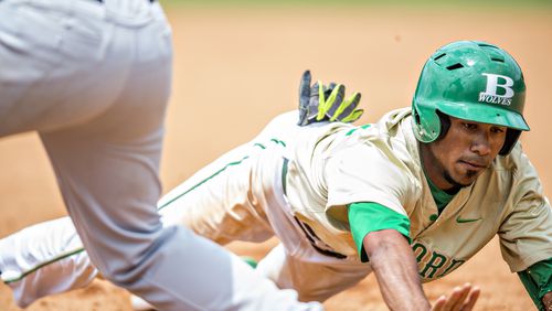 May 21, 2016 Buford - Buford's Nick Wilhite (right dives back to first base as Locust Grove's Clay Shearouse tries to pick him off during the GHSA Class AAAA Championship Baseball Tournament in Buford on Saturday, May 21, 2016. JONATHAN PHILLIPS / SPECIAL