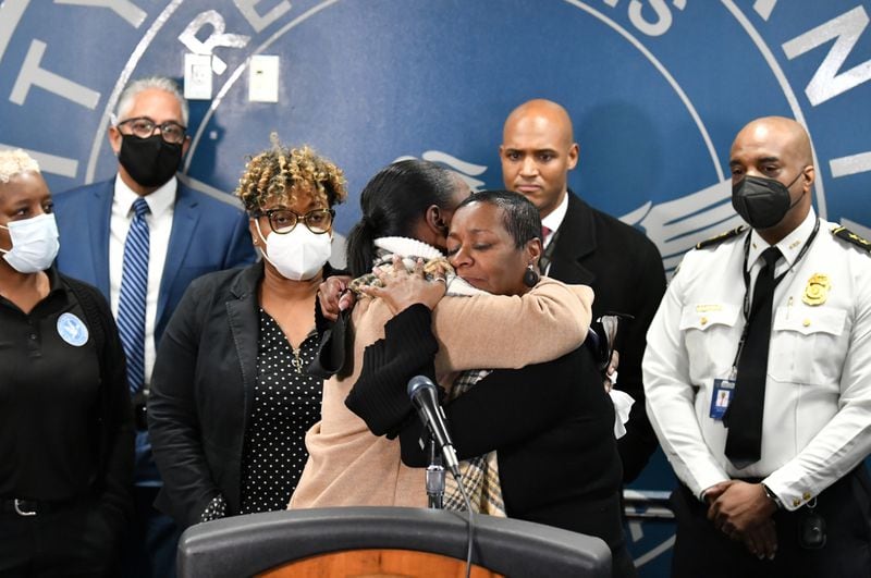 Betty Brown (foreground left), another victim, and Acquanellia Smith, mother of Nacole Smith, comfort each other during a news conference Tuesday at Atlanta Police headquarters. (Hyosub Shin / Hyosub.Shin@ajc.com)