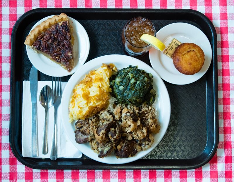 A tray of fried chicken livers with turnip greens, hashbrown casserole, a cornbread muffin, pecan pie and a sweet tea is a generous old-school lunch available on Mondays at Matthews Cafeteria in Tucker. CONTRIBUTED BY HENRI HOLLIS