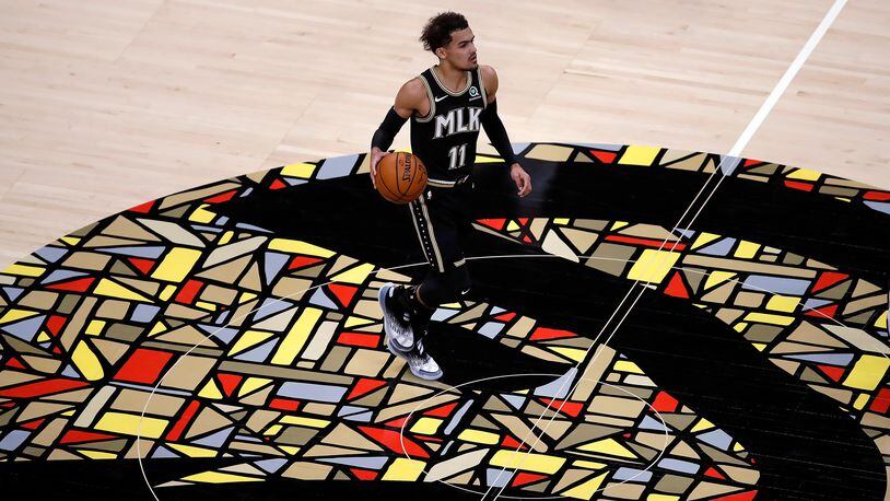 Atlanta Hawks' Trae Young brings the ball lup during the first half of the team's NBA basketball game against the Chicago Bulls on Friday, April 9, 2021, in Atlanta. (AP Photo/Ben Margot)