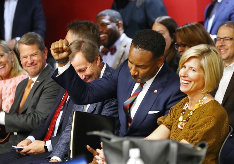 061622 Atlanta: Georgia Governor Brian Kemp (far left) smiles while Mayor Andre Dickens pumps his fist during the Host City announcement press conference for the 2026 World Cup at Mercedes-Benz Stadium on Thursday, June 16, 2022, in Atlanta.     “Curtis Compton / Curtis.Compton@ajc.com”