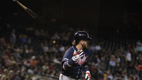 Braves' Josh Donaldson flips his bat after hitting a solo home run in the ninth inning against the Arizona Diamondbacks May 9, 2019, at Chase Field in Phoenix.