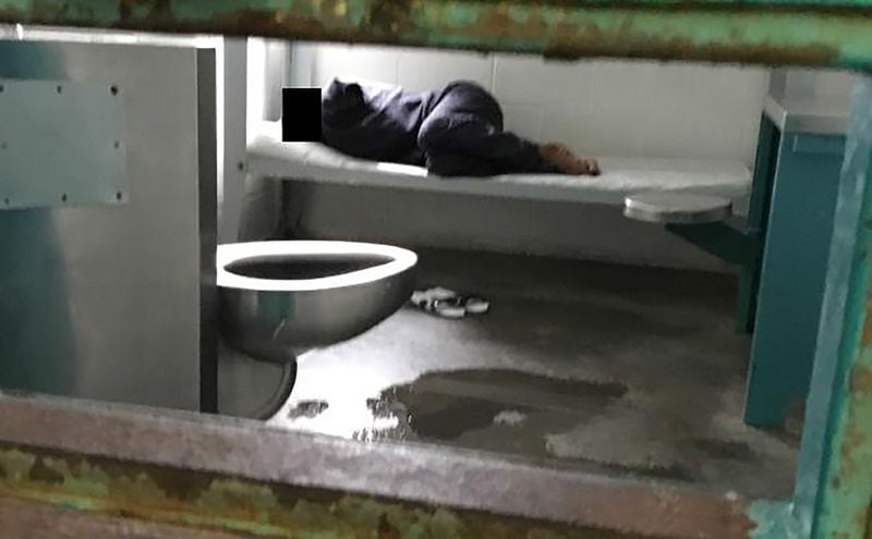A woman lies on a thin mattress in her cell with water pooled at the foot of her metal bed, as seen during a midday visit at the South Fulton Municipal Regional Jail. This image is included in a federal lawsuit filed on April 10, 2019, by the Georgia Advocacy Office and two women being held at the jail. The lawsuit includes graphic photos from a recent visit to the jail — among them this one — and details unimaginable conditions for the women detainees.