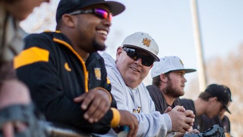Kennesaw State baseball coach Mike Sansing (center) talks with members of his team during a 2019 practice in Kennesaw.  (Branden Camp/For the AJC)