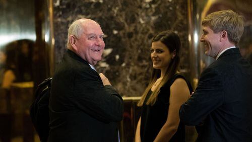 Former Georgia Gov. Sonny Perdue, left, arrives Wednesday at the Trump Tower in New York City. Perdue, who met with President-elect Donald Trump for nearly two hours, said they held a “very genuine, honest, forthright” discussion about agriculture, trade and the economy. Perdue appears to be on Trump’s short list of candidates to serve as secretary of agriculture. (Photo by Drew Angerer/Getty Images)