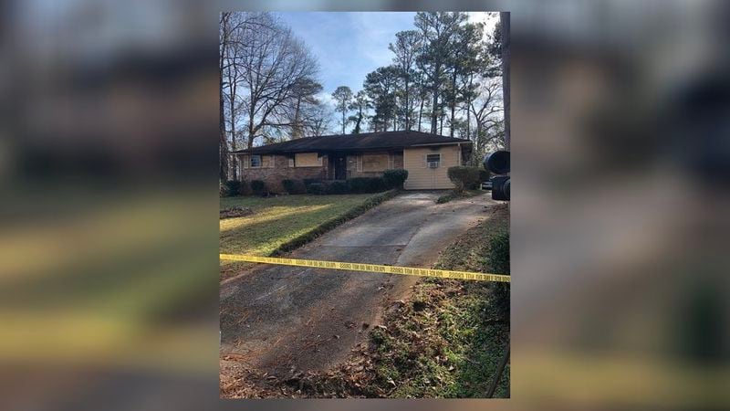 Fire officials continue their investigation into a Tuesday night fatal fire at a home on Woodcastle Lane on Wednesday. (Credit: Channel 2 Action News)