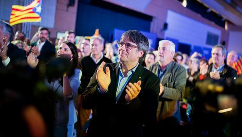 Former regional president Carles Puigdemont applauds during a campaign rally in Argelers, France, Wednesday, May 8, 2024. Carles Puidgemont, Catalonia's fugitive former leader, stares confidently out the backseat window of a car, the sun illuminating his gaze in a campaign poster for Sunday's critical elections in the northeastern Spanish region. Some nearly 6 million Catalans are called to cast ballots in regional elections on Sunday that will surely have reverberations in Spain's national politics. (AP Photo/Joan Mateu)