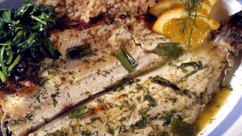 Orange juice and dry vermouth create a braising liquid for trout fillets, which are then finished in the oven. (Chicago Tribune/TNS)