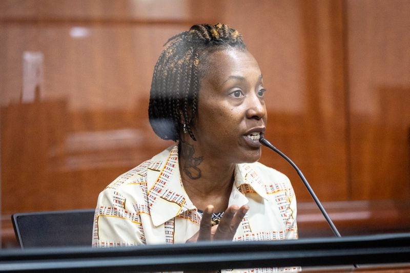 Tenant Danielle Russell testifies in May during an Atlanta municipal court hearing about persistent problems with crime and unhealthy conditions at her Pavilion Place apartment. A manager for the complex later told the judge that she had never entered Russell's unit to inspect conditions. (Arvin Temkar/arvin.temkar@ajc.com)