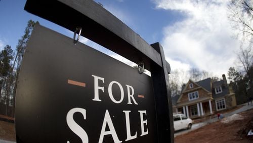 The increase in sales prices for homes has helped increase property values, which is making homeowners pay more in school property taxes. (AP Photo/John Bazemore, File)