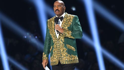 ATLANTA, GEORGIA - DECEMBER 08: (EDITORIAL USE ONLY) Steve Harvey speaks onstage during 2019 Miss Universe Pageant at Tyler Perry Studios on December 08, 2019 in Atlanta, Georgia. (Photo by Paras Griffin/Getty Images)