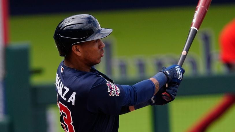 Atlanta Braves' Ehire Adrianza follows through on a two-run base hit in the fifth inning of a spring training game against the Boston Red Sox, Saturday, March 20, 2021, at CoolToday Park in North Port, Fla. (John Bazemore/AP)
