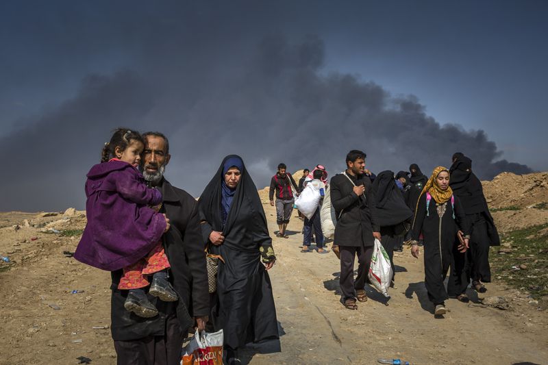 Civilians flee clashes between Iraqi forces and Islamic State fighters in western Mosul, Iraq. (Ivor Prickett/The New York Times)