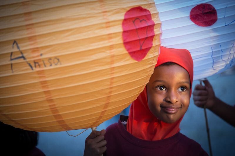 Anisa Sharif holds her handmade lantern before the start of the Decatur Lantern Parade in Decatur, Ga. Friday night May 13, 2016. STEVE SCHAEFER / SPECIAL TO THE AJC