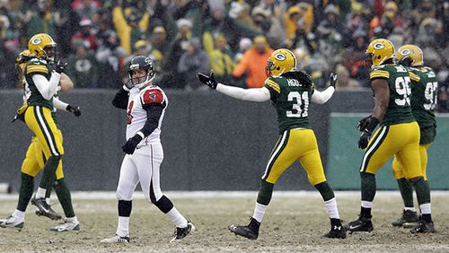 Atlanta Falcons kicker Matt Bryant reacts as Green Bay Packers players celebrate his missed field goal attempt during the second half of an NFL football game Sunday, Dec. 8, 2013, in Green Bay, Wis. (AP Photo/Tom Lynn)