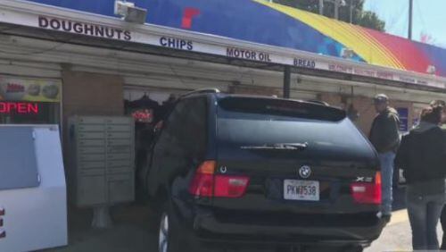 Junior Patel was behind the counter at Big Shanty Supertte on Thursday when a BMW X6 drove right into the building. (Credit: Channel 2 Action News)