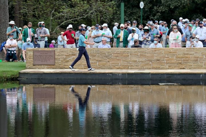 April 9, 2021, Augusta: The gallery watches as Justin Thomas crosses the Sarazen Bridge to the fifteen green during the second round of the Masters at Augusta National Golf Club on Friday, April 9, 2021, in Augusta. Curtis Compton/ccompton@ajc.com