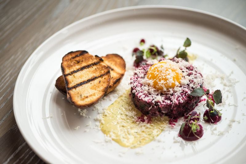 Tin Tin Steak Tartare with classic accoutrements, fresh horseradish, beets, and oyster aioli. Photo credit- Mia Yakel.