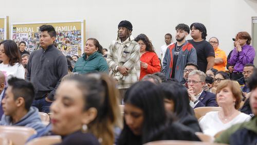 Gwinnett County residents wait in line to ask questions during a police town hall addressing youth violence and drug overdoses at Universal Church in Norcross on Thursday, March 9, 2023. (Natrice Miller/ Natrice.miller@ajc.com)