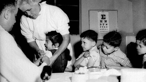 First and second graders at a school in Los Angeles were among the first to be innoculated with the new polio vaccine in 1955. Georgia health experts say that a new case of polio detected in New York is a wake-up call. (AP file)