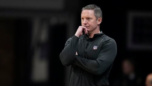 Georgia head coach Mike White watches from the bench in the first half of an NCAA college basketball game against Seton Hall in the semifinals of the NIT, Tuesday, April 2, 2024, in Indianapolis. Georgia lost 84-67. (AP Photo/Michael Conroy)