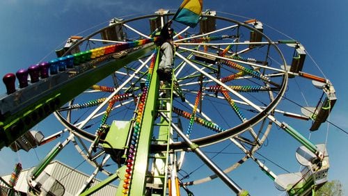 In this file photo, the ferris wheel goes up for the Yaarab Shrine Circus, held annually at Jim R. Miller Park in Marietta.