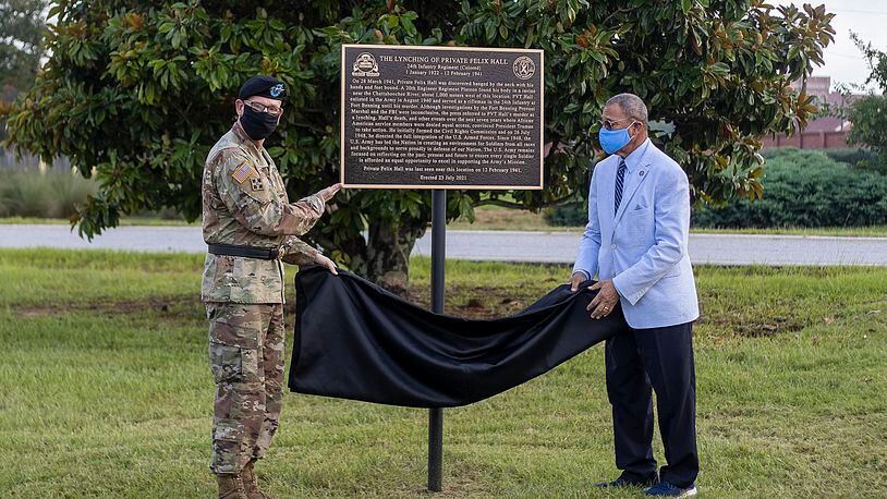 08/03/2021 —Fort Benning, Georgia — Congressman Sanford D. Bishop Jr., right, and Army Lt. Gen. Theodore D. Martin unveil a memorial for Pvt. Felix Hall at Fort Benning, Tuesday, August 3, 2021. Hall was lynched at the base in 1941. (Alyssa Pointer/Atlanta Journal Constitution)
