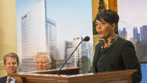 12/12/2018 — Atlanta, Georgia — Georgia Governor-Elect Brian Kemp (left), Governor Nathan Deal (center) listen as Atlanta Mayor Keisha Lance Bottoms (right) speaks during a press conference in the Georgia State Capitol building in Atlanta, Wednesday, December 12, 2018. During the presser, Fortune 500 company Norfolk Southern officially announced that they will be moving their headquarters to Atlanta. They will be building in Atlanta’s Midtown community. (ALYSSA POINTER/ALYSSA.POINTER@AJC.COM)