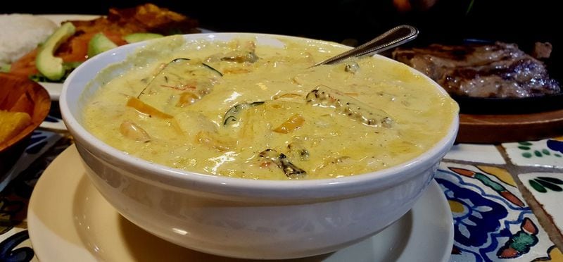Cazuela de Mariscos from Casa Vieja is a creamy seafood stew. LIGAYA FIGUERAS / LFIGUERAS@AJC.COM