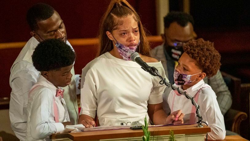 07/15/2020 - Atlanta, Georgia - Charmaine Turner, center, mother of Secoriea Turner, is surrounded by her sons and SecorieaÕs father, Secoriey Williamson, second from left, as she becomes emotional while reciting a poem during the home-going service for Secoriea at New Calvary Missionary Church in AtlantaÕs Sylvan Hills community, Wednesday, July 15, 2020. On July 4, 8-year-old Secoriea was shot dead by armed civilians who had commandeered a street in AtlantaÕs Peoplestown community. She was one of five individuals who were killed over the Independence Day Weekend in Atlanta. (ALYSSA POINTER / ALYSSA.POINTER@AJC.COM)