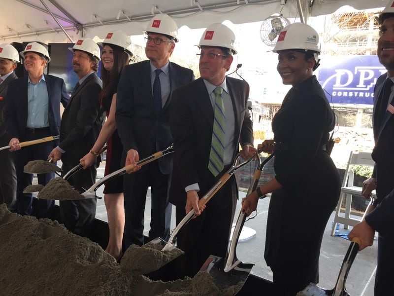 Atlanta Mayor Keisha Lance Bottoms, second from right, Anthem Chief Information Officer Tom Miller, Lt. Gov. Casey Cagle and other dignitaries turn some ceremonial dirt at a ground breaking for the new 21-story Anthem technology hub in Midtown Atlanta. The Portman Holdings tower will open in the first quarter of 2020. Ariel Hart/ARIEL.HART@AJC.com