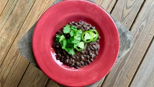 Warmly Spiced Black Beans is a side dish that will perk up your dinnertime. John Kessler for The AJC