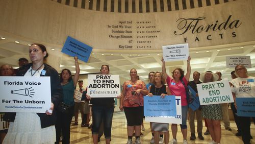 FILE - Supporters of Florida Voice For The Unborn demonstrate outside the fourth floor as legislators work on property insurance bills, May 24, 2022, at the state Capitol in Tallahassee, Fla. The Florida Supreme Court ruled Monday, April 1, 2024, that a ballot measure to enshrine the right to abortion in the state constitution can go before voters in November. (AP Photo/Phil Sears, File)