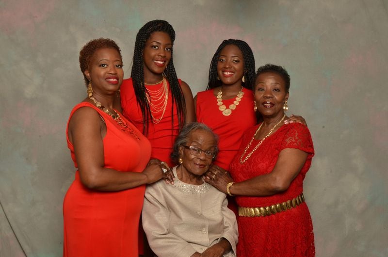 Rev. Emma Rowland sits among (left to right) her granddaughter Cheryl Pope Clark, great grand-daughter Calina Clark and great grand-daughter Christian Clark and daughter Vera L. Pope.