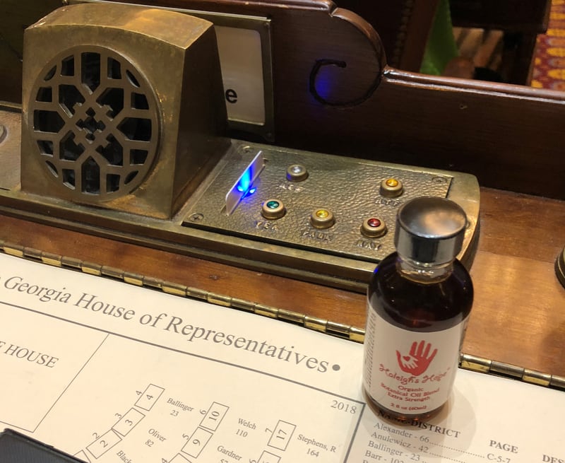 Low-THC cannabis oil on a legislator's desk in the state Capitol, circa 2018.