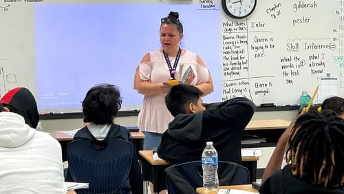 Jennifer Dallas reads a book with her fifth grade class at Heards Ferry Elementary School in Fulton County. The school made the state's list of "Literacy Leaders" for the 2022-23 school year. (Martha Dalton/martha.dalton@ajc.com)
