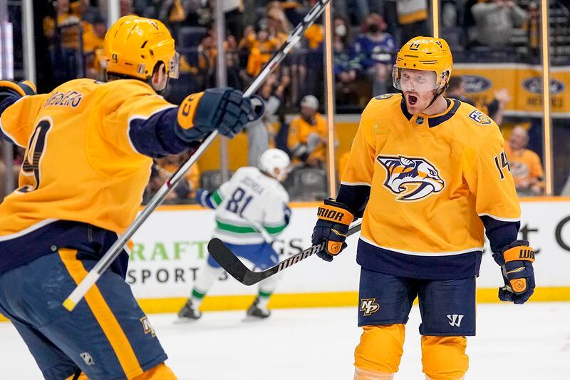 Nashville Predators center Gustav Nyquist (14) celebrates his goal against the Vancouver Canucks with teammate left wing Filip Forsberg (9) during the second period in Game 4 of an NHL hockey Stanley Cup first-round playoff series Sunday, April 28, 2024, in Nashville, Tenn. (AP Photo/George Walker IV)