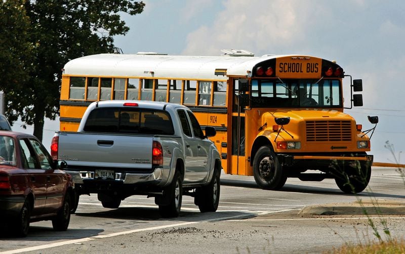 1105027 Lilburn; A Gwinnett County School bus makes the turn onto Steve Reynolds Blvd from Indian Trail Lilburn Road during the last day of school for Gwinnett County Friday afternoon in Lilburn, Ga., May 27, 2011. Most of Metro Atlanta schools are out for summer and when traffic resumes after Memorial Day how will traffic be affected. What are some of the main traffic arteries and surface streets that will be relieved now that the buses and carpool parents are off the roads? Jason Getz jgetz@ajc.com